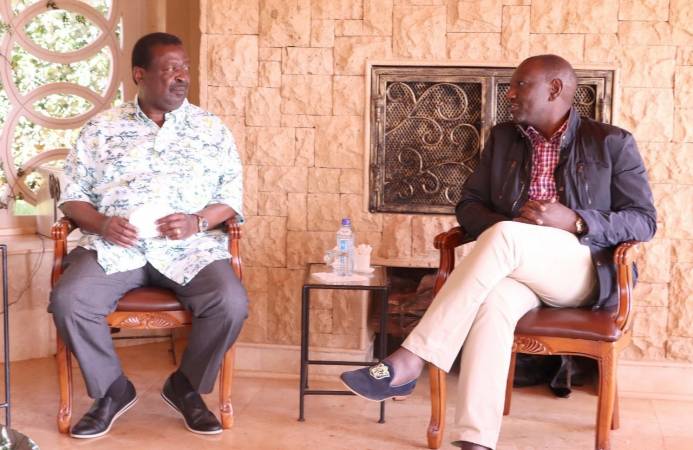 ANC party leader Musalia Mudavadi and Deputy President William Ruto in a discussion during a previous meeting. PHOTO/COURTESY