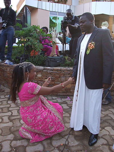 Zari Hassan kneeling before her late husband Ivan Ssemwanga during their traditional wedding.