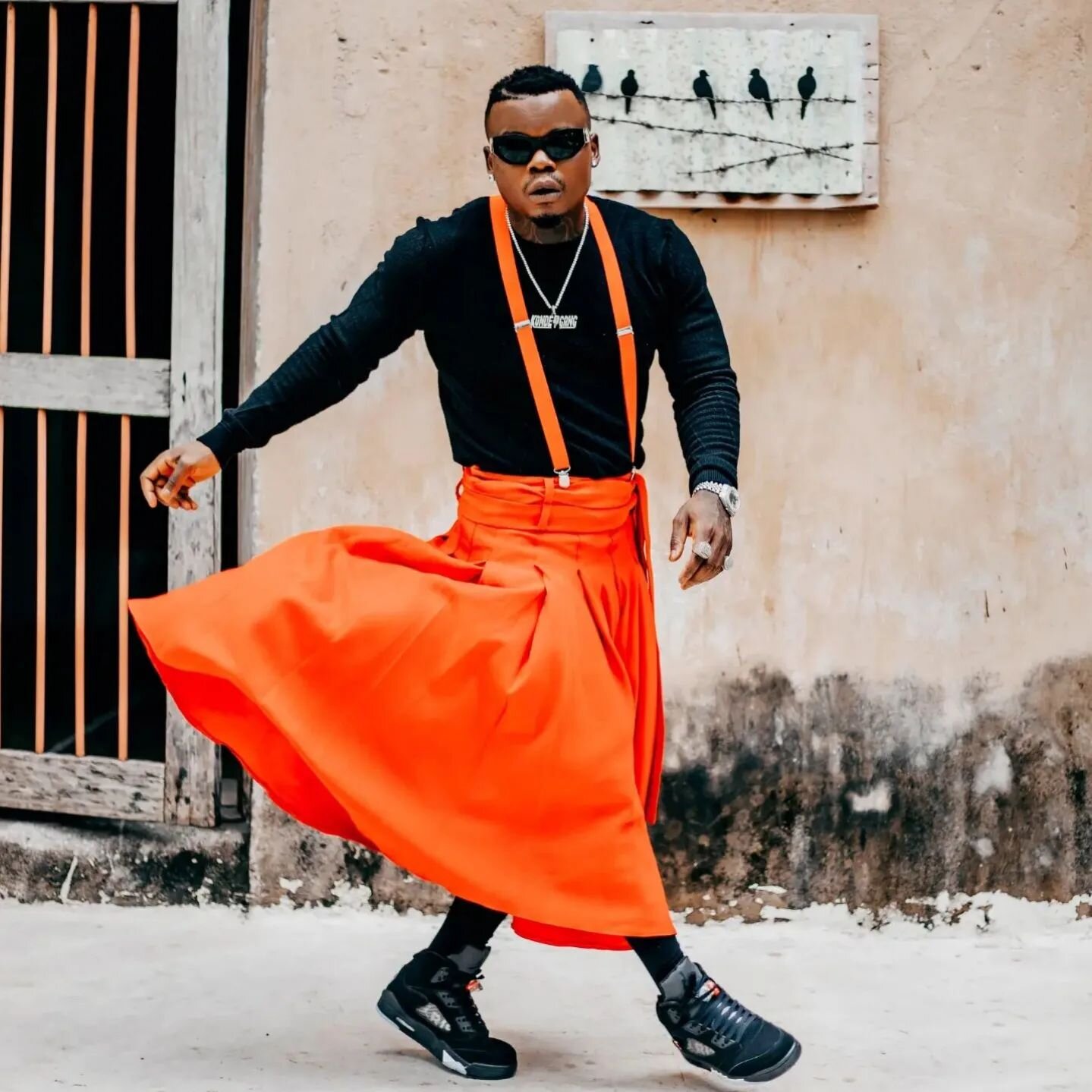 Harmonize rocks an orange dress