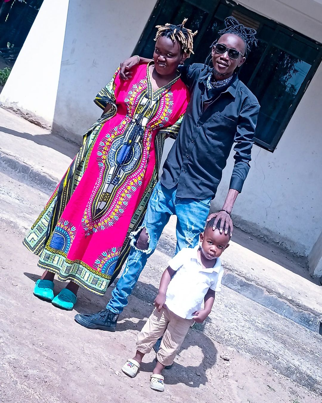 Akuku Danger with his wife and son 