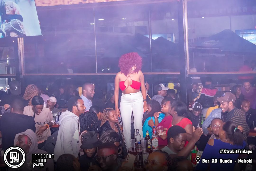 Strip Club? Female Revellers Go Wild At Bar XO Runda As They Twerk On Top Of Tables And Chairs 